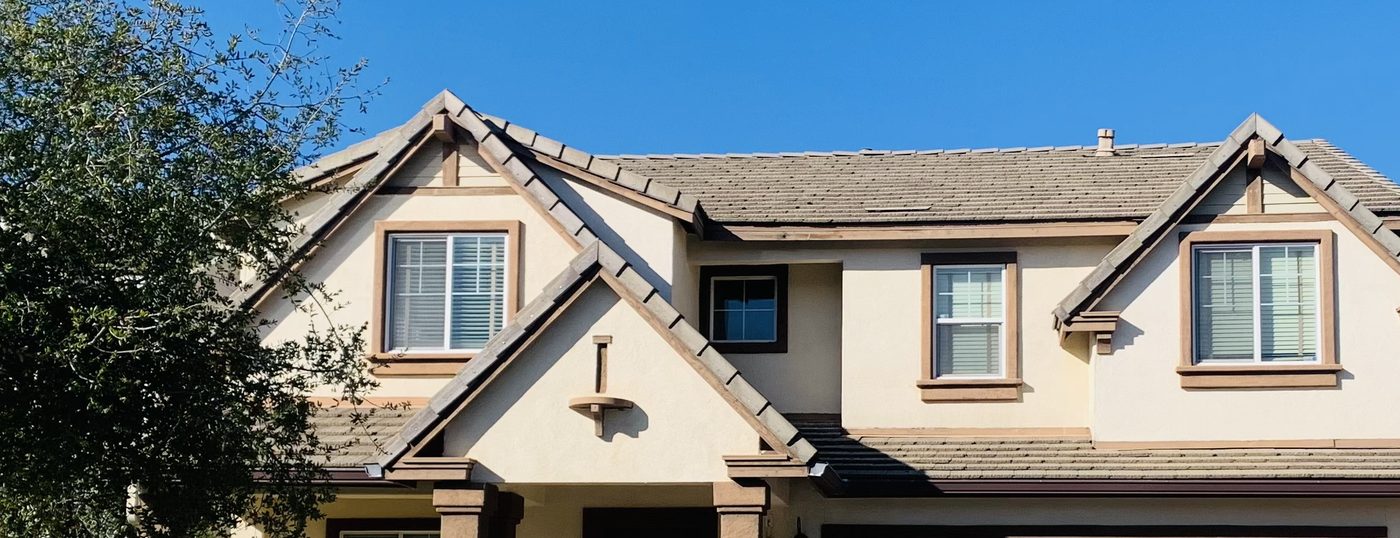 Gables and tile roofline of a two-story home in a newer residential subdivision on the east side of Paso Robles, California